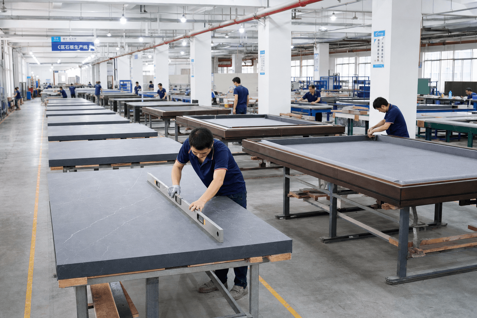 Production floor — frame and slate QC before cloth installation.